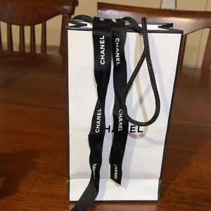 Authentic new Chanel small rare size paper bag with ChanelLogo ribbon, brand new